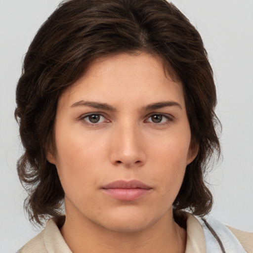 Neutral white young-adult female with medium  brown hair and brown eyes