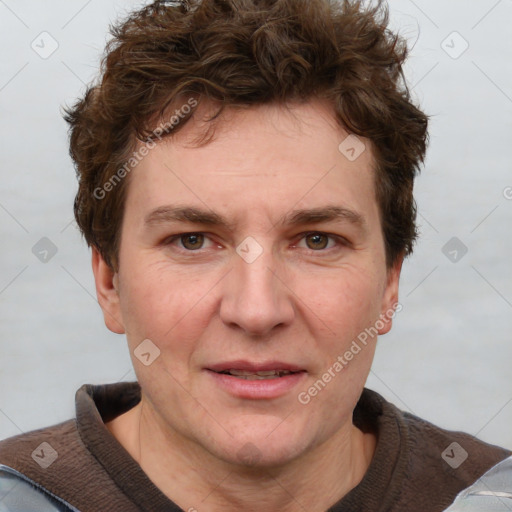 Joyful white adult male with short  brown hair and grey eyes