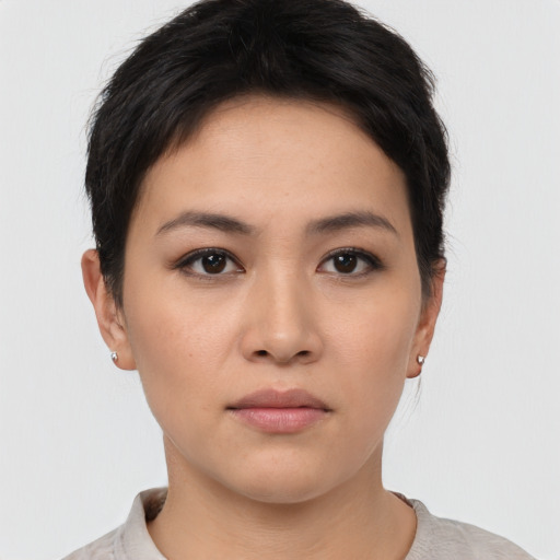 Neutral white young-adult female with short  brown hair and brown eyes