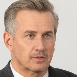 Neutral white middle-aged male with short  brown hair and brown eyes