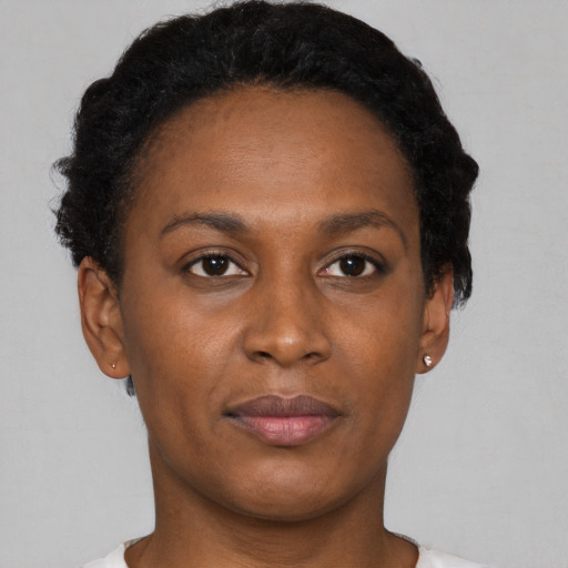 Neutral black young-adult female with short  black hair and brown eyes
