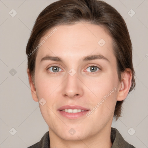 Joyful white young-adult female with short  brown hair and grey eyes