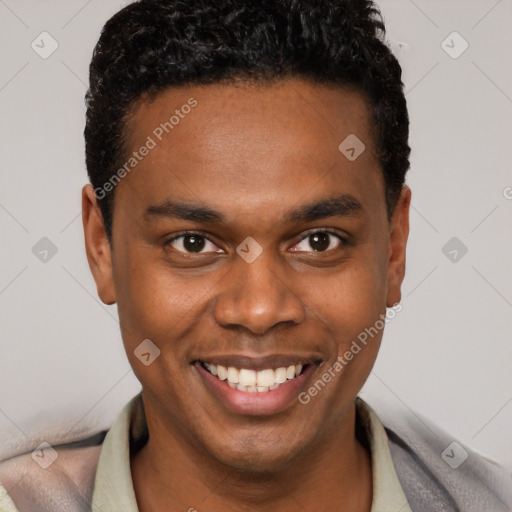 Joyful black young-adult male with short  brown hair and brown eyes