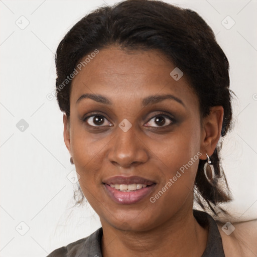 Joyful black young-adult female with medium  brown hair and brown eyes