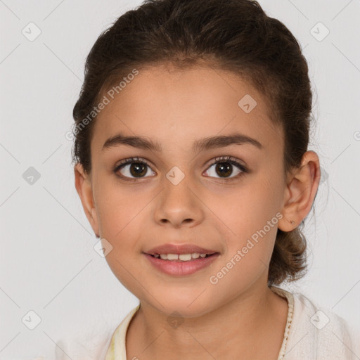 Joyful white child female with medium  brown hair and brown eyes