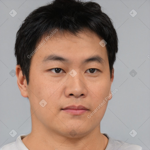 Neutral asian young-adult male with short  brown hair and brown eyes