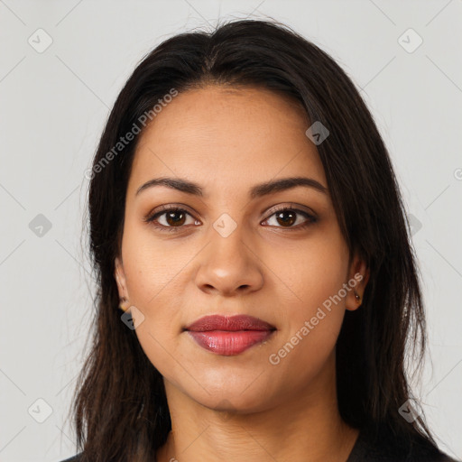 Joyful latino young-adult female with long  brown hair and brown eyes