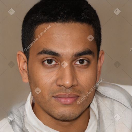 Joyful latino young-adult male with short  brown hair and brown eyes