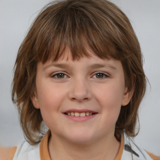 Joyful white child female with medium  brown hair and grey eyes