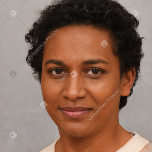 Joyful black adult female with short  brown hair and brown eyes