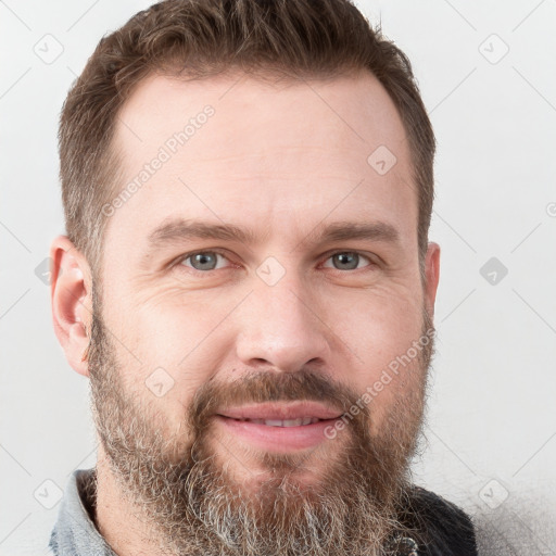 Joyful white adult male with short  brown hair and grey eyes