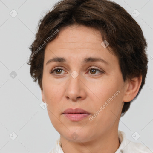 Joyful white adult female with short  brown hair and brown eyes