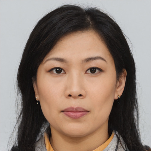 Neutral asian young-adult female with medium  brown hair and brown eyes