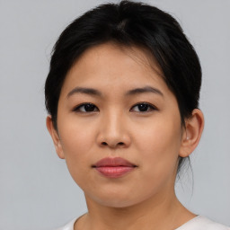 Joyful asian young-adult female with short  brown hair and brown eyes