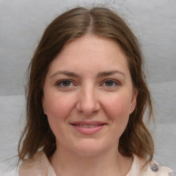 Joyful white young-adult female with medium  brown hair and grey eyes