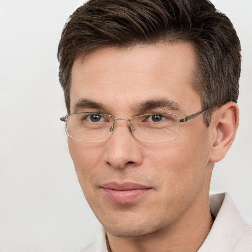 Joyful white adult male with short  brown hair and brown eyes