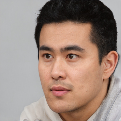 Neutral asian young-adult male with short  black hair and brown eyes