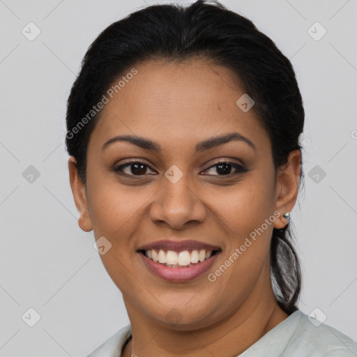 Joyful latino young-adult female with short  brown hair and brown eyes