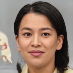 Joyful asian adult female with medium  brown hair and brown eyes