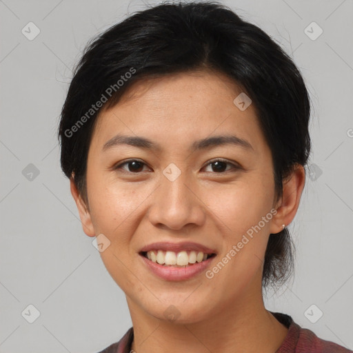 Joyful asian young-adult female with short  brown hair and brown eyes