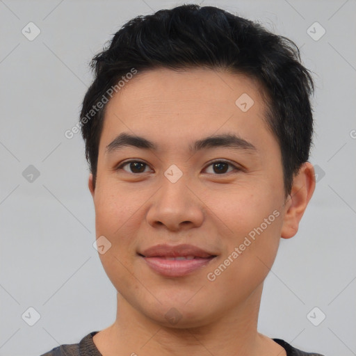 Joyful asian young-adult male with short  brown hair and brown eyes