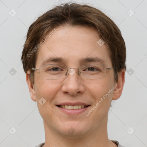 Joyful white adult male with short  brown hair and grey eyes