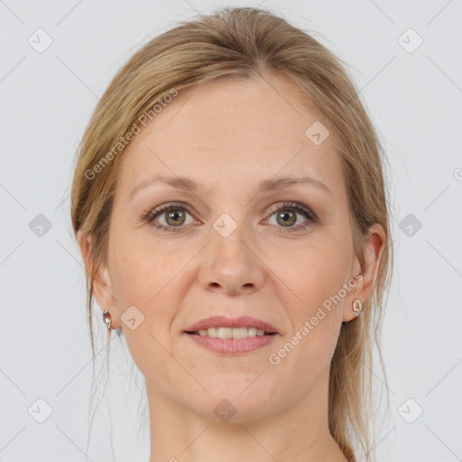 Joyful white adult female with medium  brown hair and grey eyes