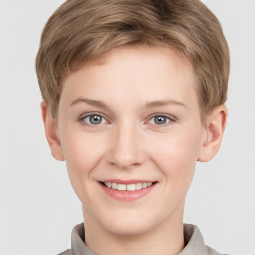 Joyful white young-adult female with short  brown hair and grey eyes