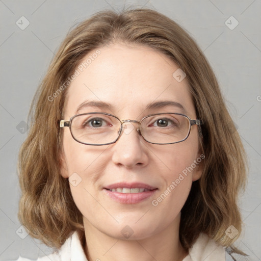 Joyful white adult female with medium  brown hair and grey eyes