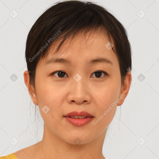 Joyful asian young-adult female with short  brown hair and brown eyes