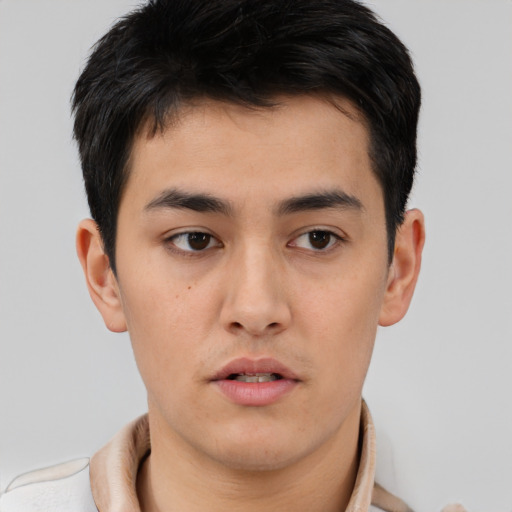Neutral asian young-adult male with short  brown hair and brown eyes