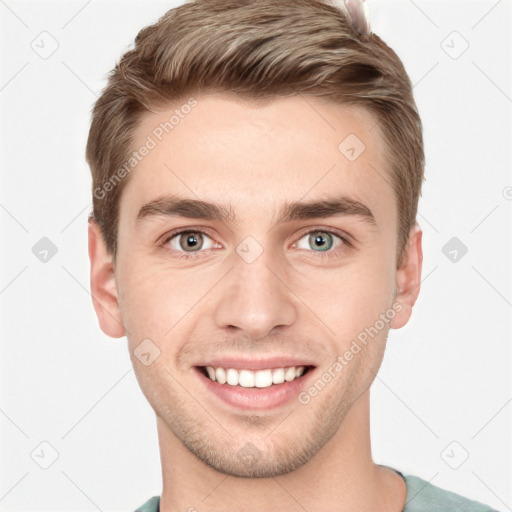 Joyful white young-adult male with short  brown hair and grey eyes