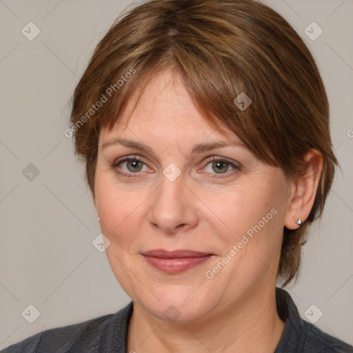 Joyful white adult female with medium  brown hair and grey eyes