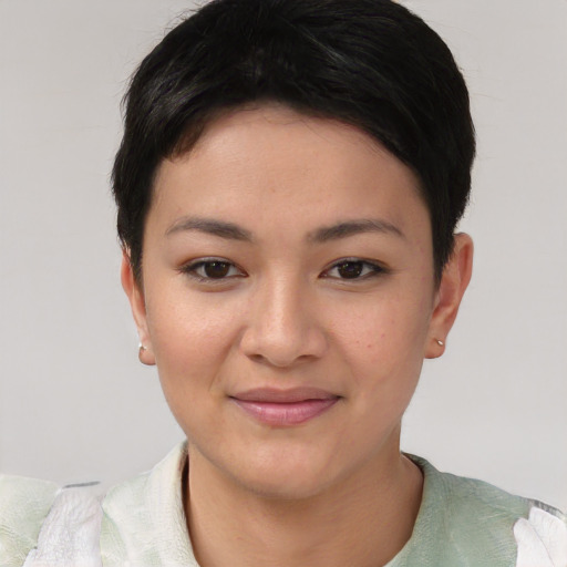 Joyful asian young-adult female with short  black hair and brown eyes