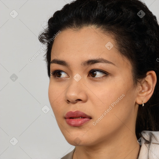 Joyful asian young-adult female with short  black hair and brown eyes