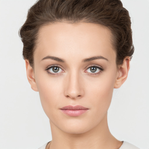 Neutral white young-adult female with short  brown hair and brown eyes