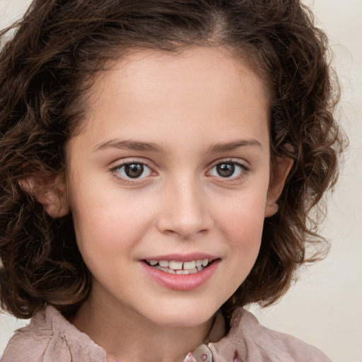 Joyful white child female with medium  brown hair and brown eyes