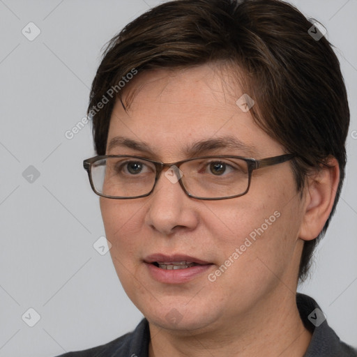 Joyful white adult female with short  brown hair and brown eyes