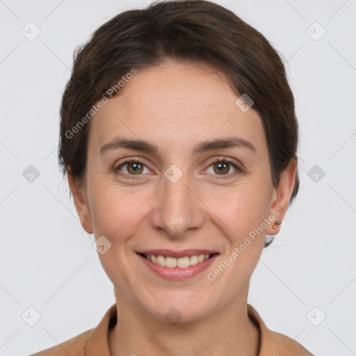 Joyful white young-adult female with short  brown hair and grey eyes