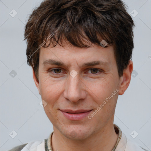 Joyful white adult male with short  brown hair and brown eyes