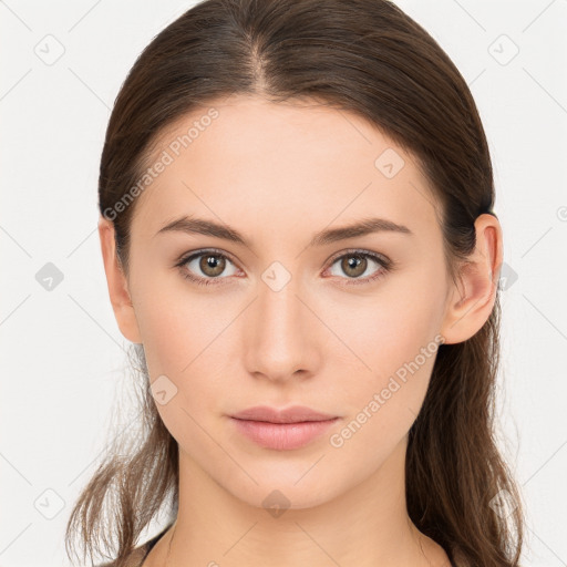 Neutral white young-adult female with long  brown hair and brown eyes