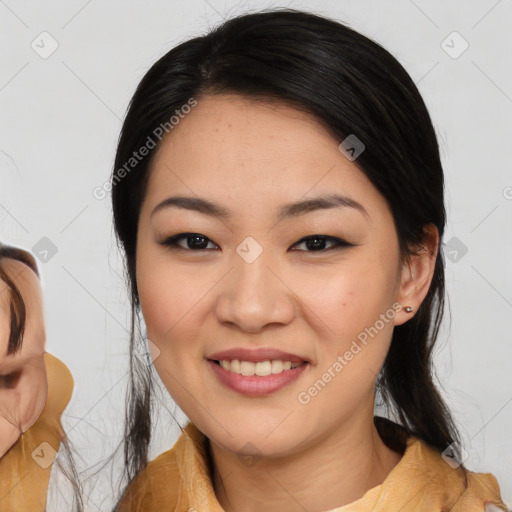 Joyful asian young-adult female with medium  black hair and brown eyes