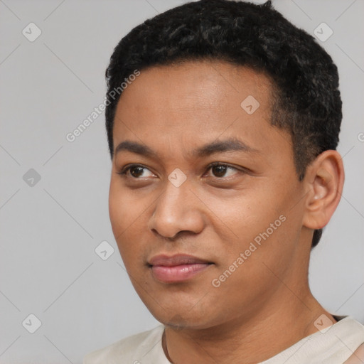 Neutral latino young-adult male with short  black hair and brown eyes