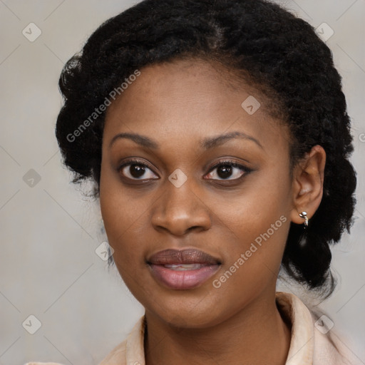 Joyful black young-adult female with long  black hair and brown eyes