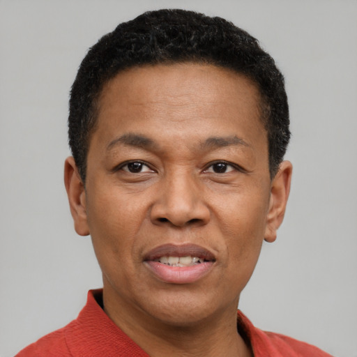 Joyful latino adult male with short  black hair and brown eyes
