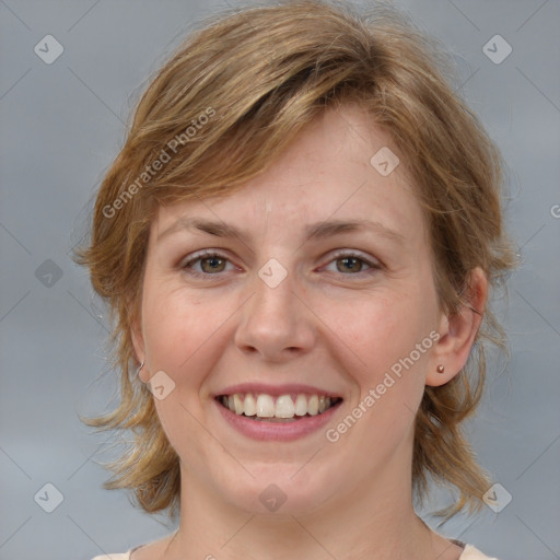 Joyful white young-adult female with medium  brown hair and blue eyes