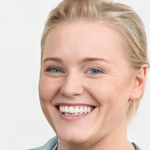 Joyful white young-adult female with short  brown hair and blue eyes