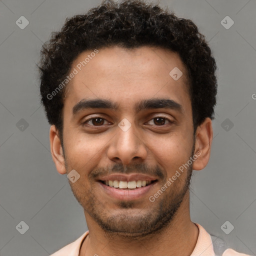 Joyful latino young-adult male with short  brown hair and brown eyes