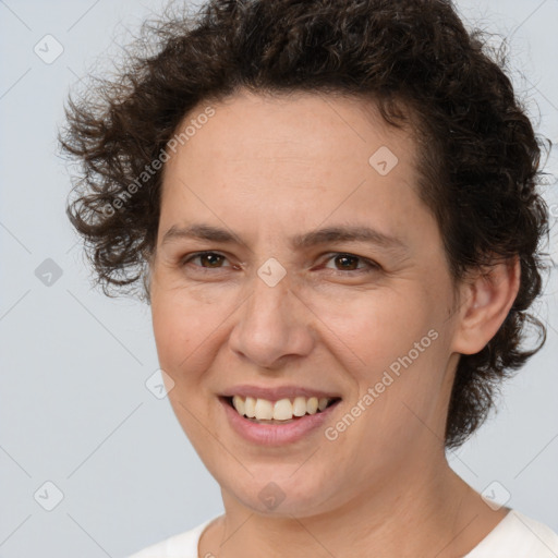 Joyful white adult female with short  brown hair and brown eyes