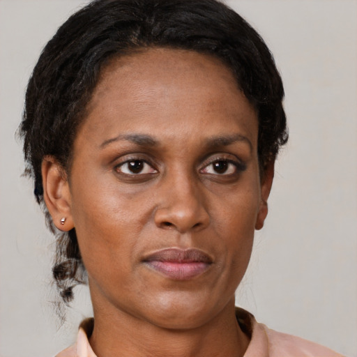 Neutral latino adult female with short  black hair and brown eyes